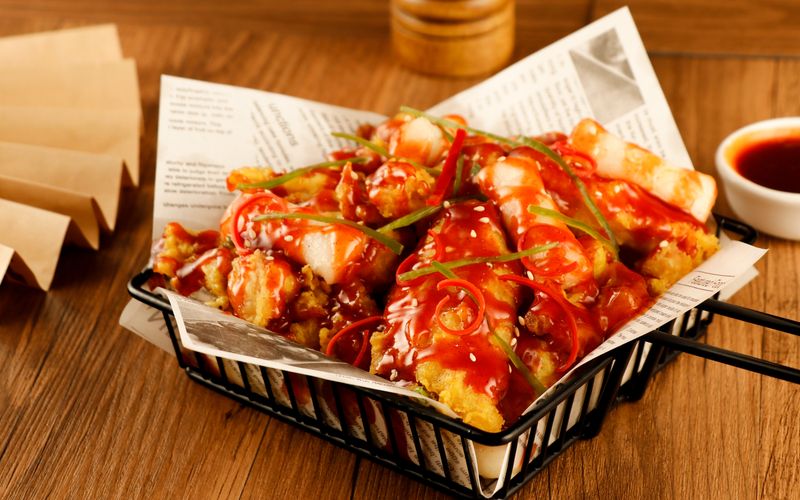 Nashville hot tenders wings over spicy style