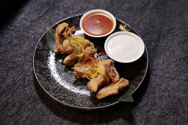 Classic Buffalo wings over crispy tossed in buffalo sauce